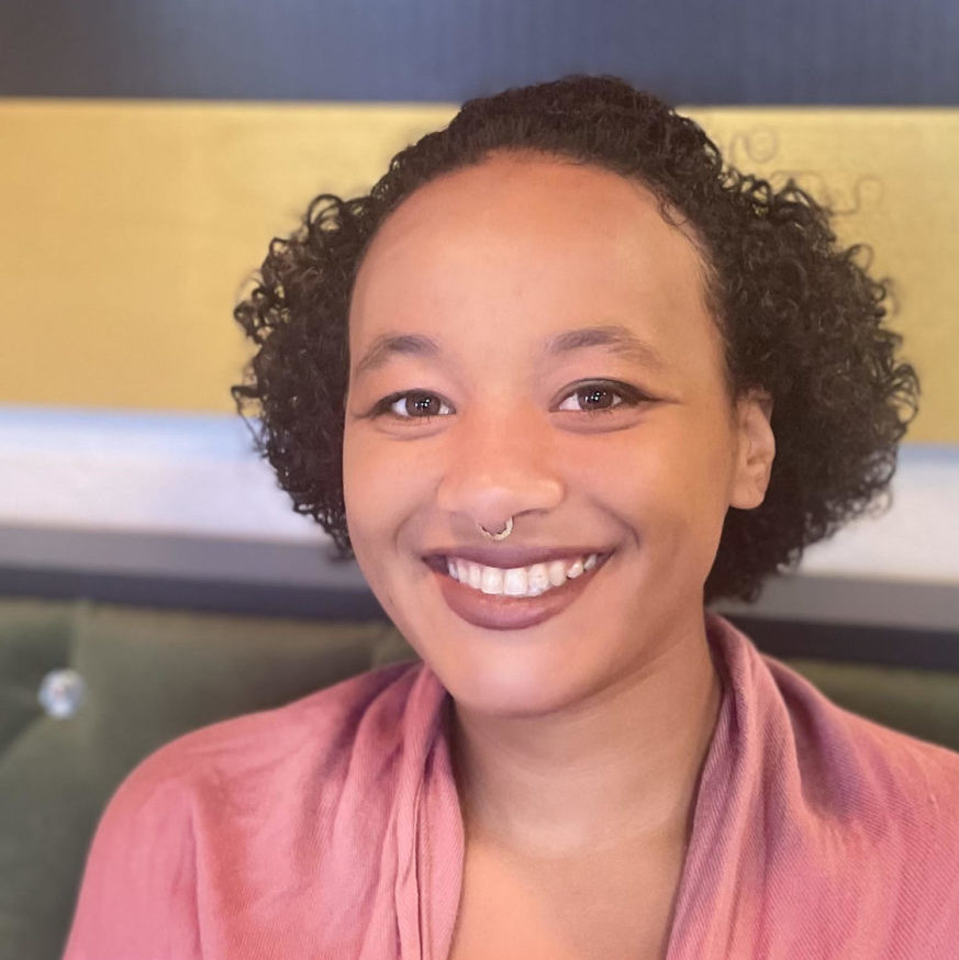 Headshot of Jazmine - young, Black woman - smiling